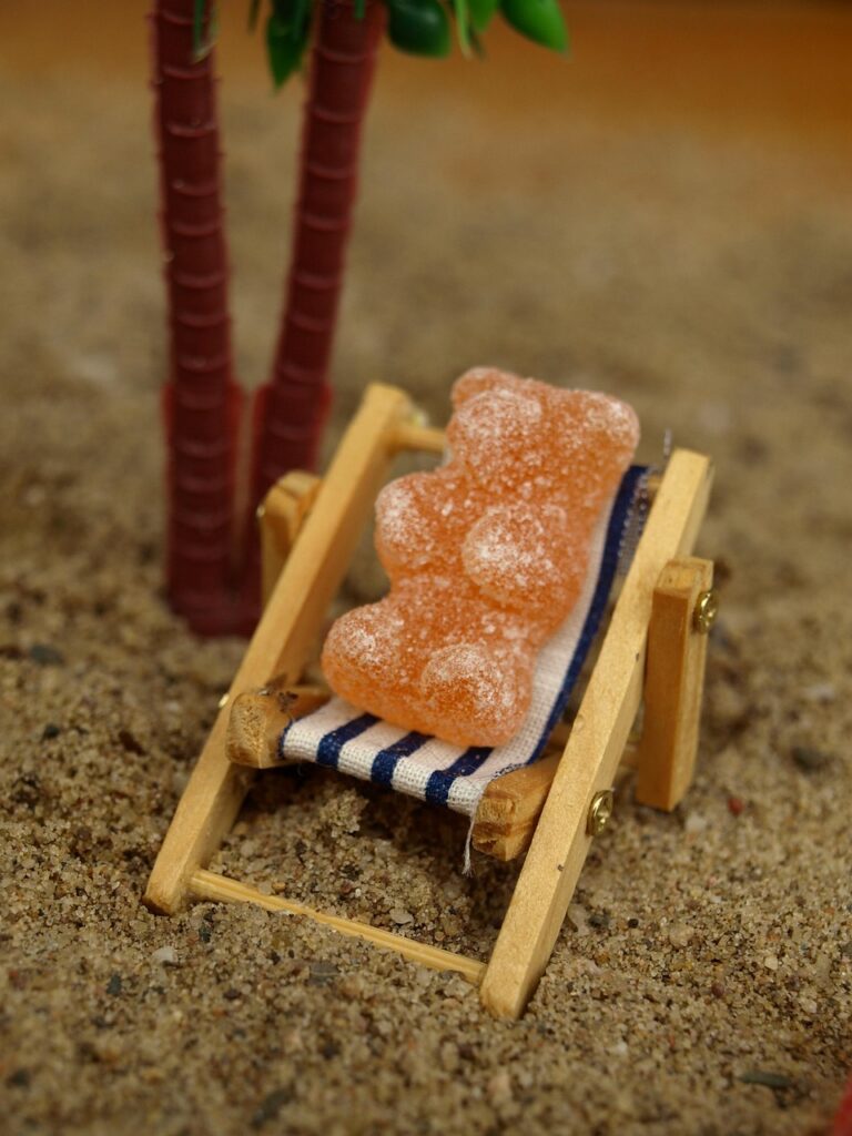 deck chair, gummy bear, sand, relax